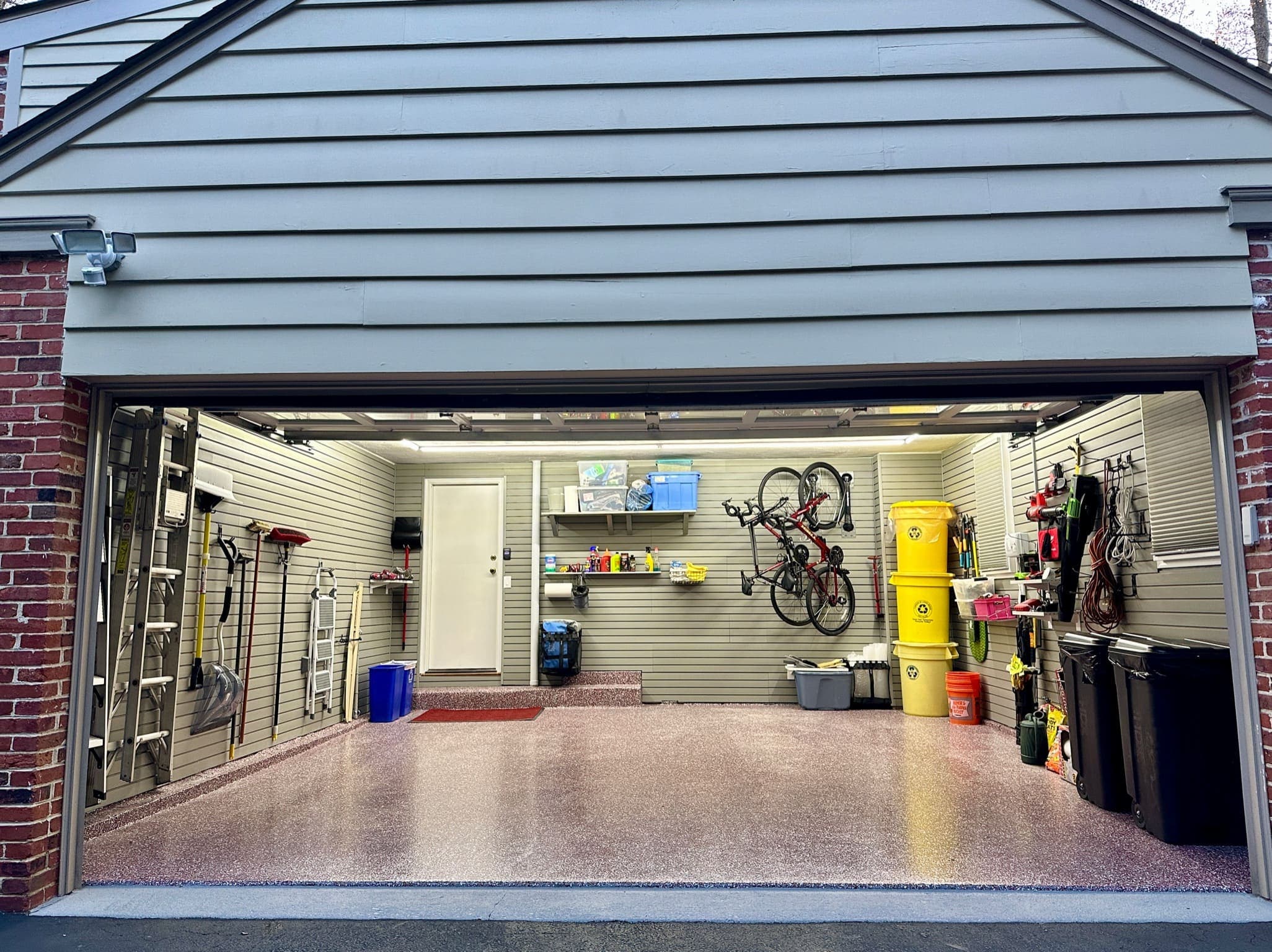 Final shots at dusk. High intensity lights are installed so you can work or park safely after dark. Good lighting makes the garage usable at any time of day and adds security.
